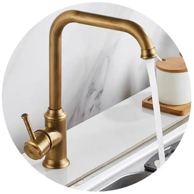 Antique brass kitchen faucet with swivel spout and single lever handle