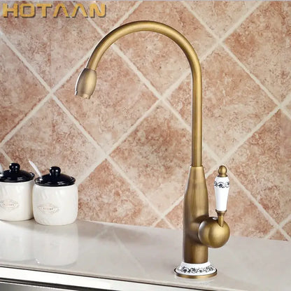 Antique brass kitchen faucet with floral ceramic handle