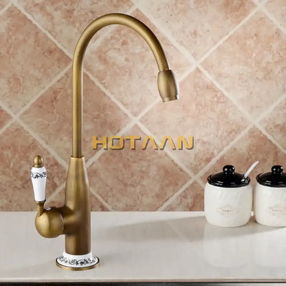 Antique brass kitchen faucet with floral ceramic handle