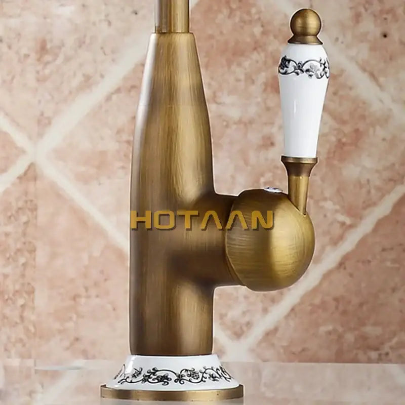 Antique brass kitchen faucet with floral ceramic handle