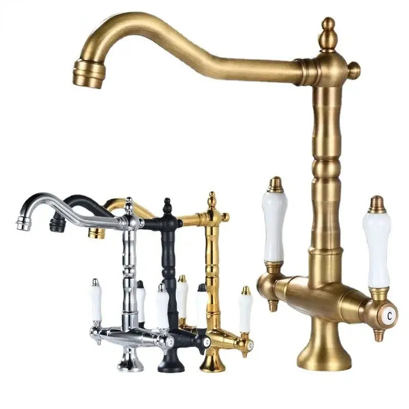 Antique brass kitchen faucet with ceramic handles and curved spout