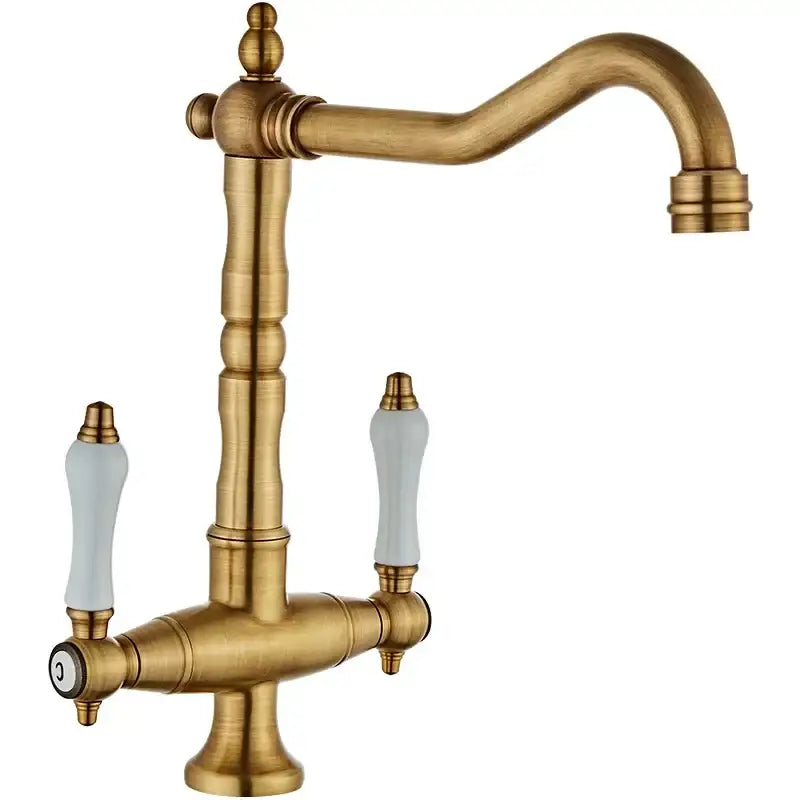 Antique brass kitchen faucet with ceramic handles and curved spout