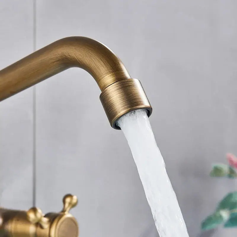 Antique brass wall mounted kitchen faucet with cross handles