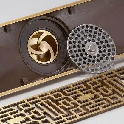 Antique brass linear shower floor drain with carved cover for bathroom