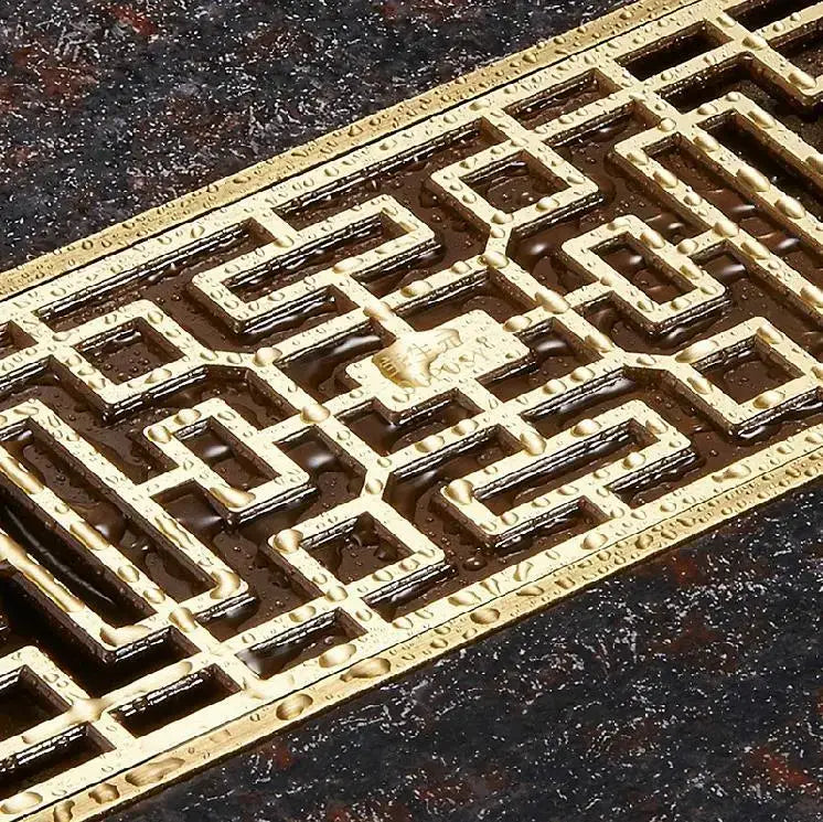 Antique brass linear shower floor drain with carved cover for bathroom
