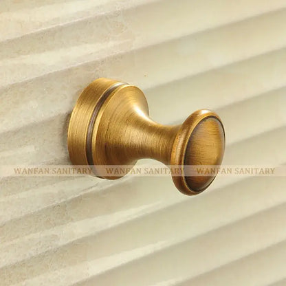 Antique brass robe hook with floral engraving and rope bathroom hook