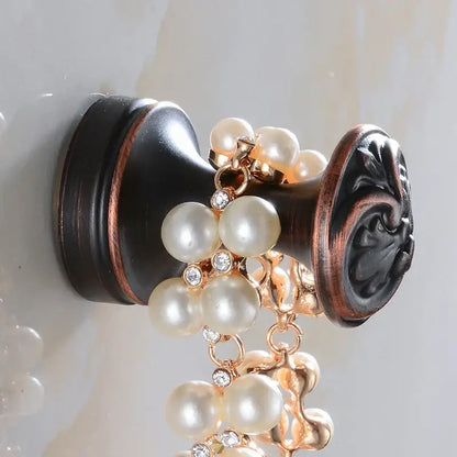 Antique brass robe hook with floral engraving and rope bathroom hook
