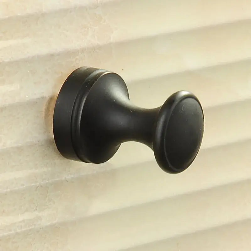 Antique brass robe hook with floral engraving and rope bathroom hook