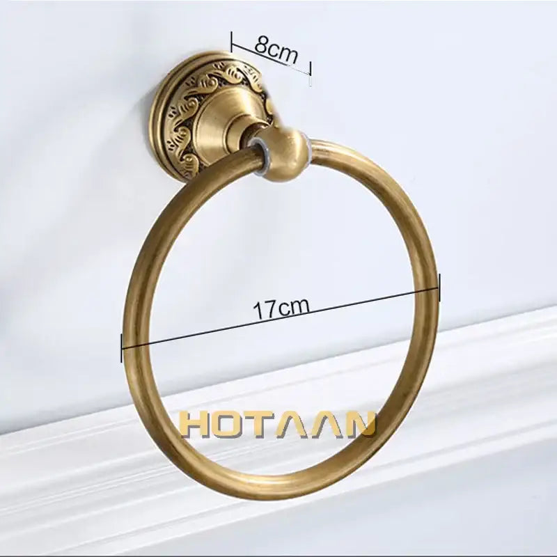 Antique brass round towel ring with ornate leaf mount for bathroom