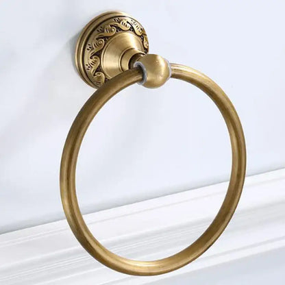Antique brass round towel ring with ornate leaf mount for bathroom