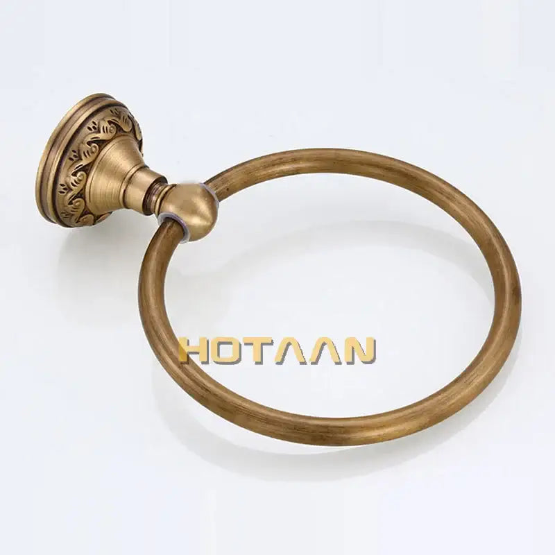 Antique brass round towel ring with ornate leaf mount for bathroom