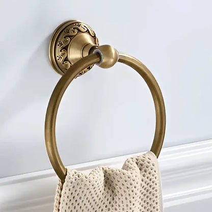 Antique brass round towel ring with ornate leaf mount for bathroom