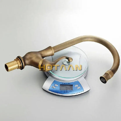 Antique brass ornate kitchen basin mixer tap with curved spout