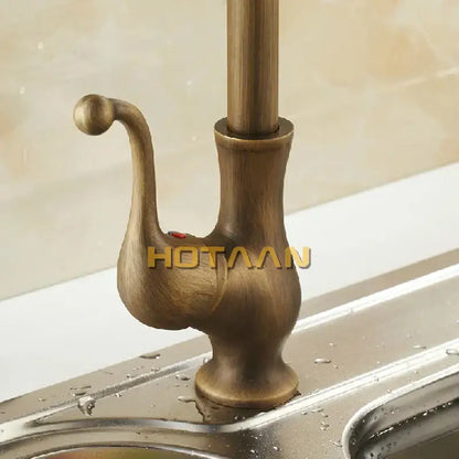 Antique brass ornate kitchen basin mixer tap with curved spout