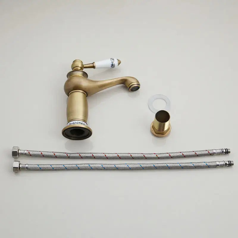 Antique brass swivel bathroom faucet with crystal handle