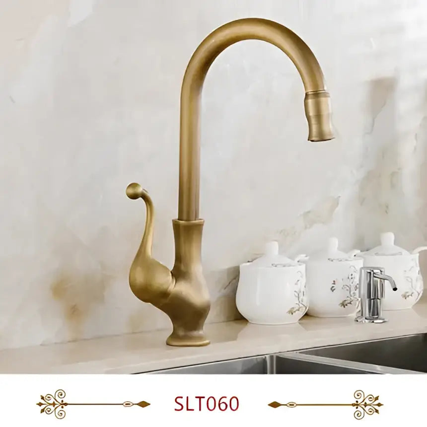 Antique brass swivel spout kitchen faucet with floral ceramic handle