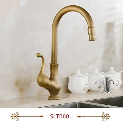 Antique brass swivel spout kitchen faucet with floral ceramic handle