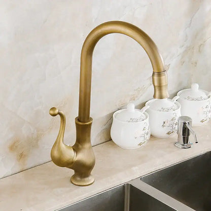Antique brass swivel spout kitchen faucet with floral ceramic handle