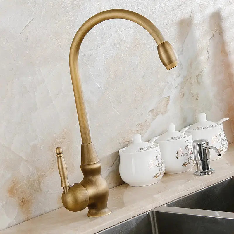 Antique brass swivel spout kitchen faucet with floral ceramic handle