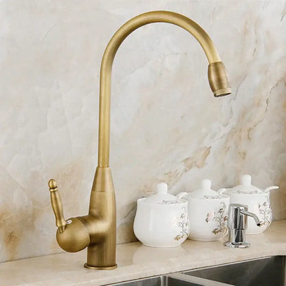Antique brass swivel spout kitchen faucet with floral ceramic handle