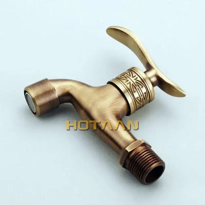 Ornate embossed antique brass wall mount faucet bathroom fixture