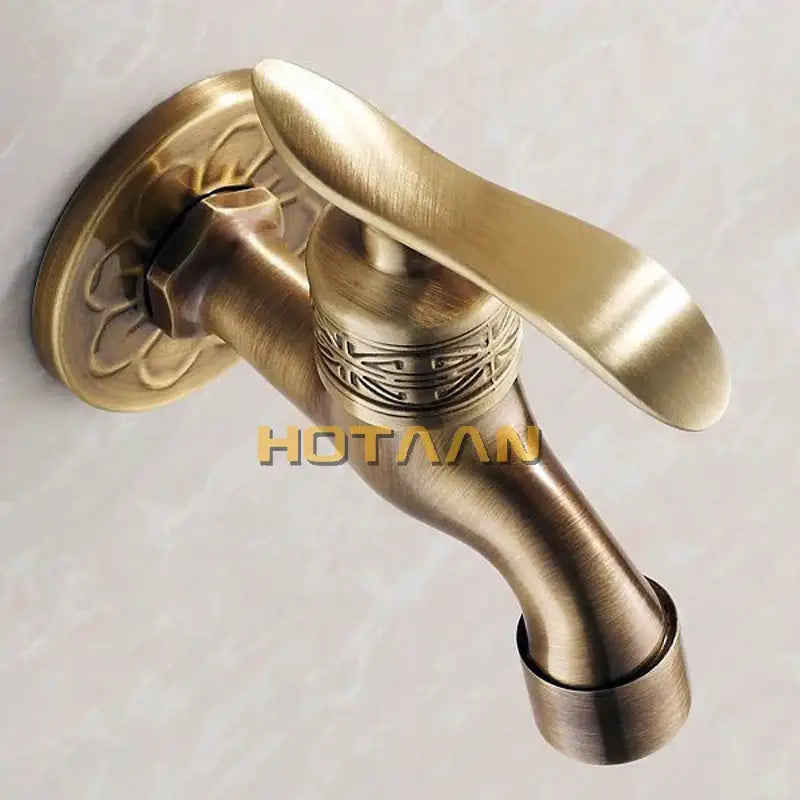 Ornate embossed antique brass wall mount faucet bathroom fixture