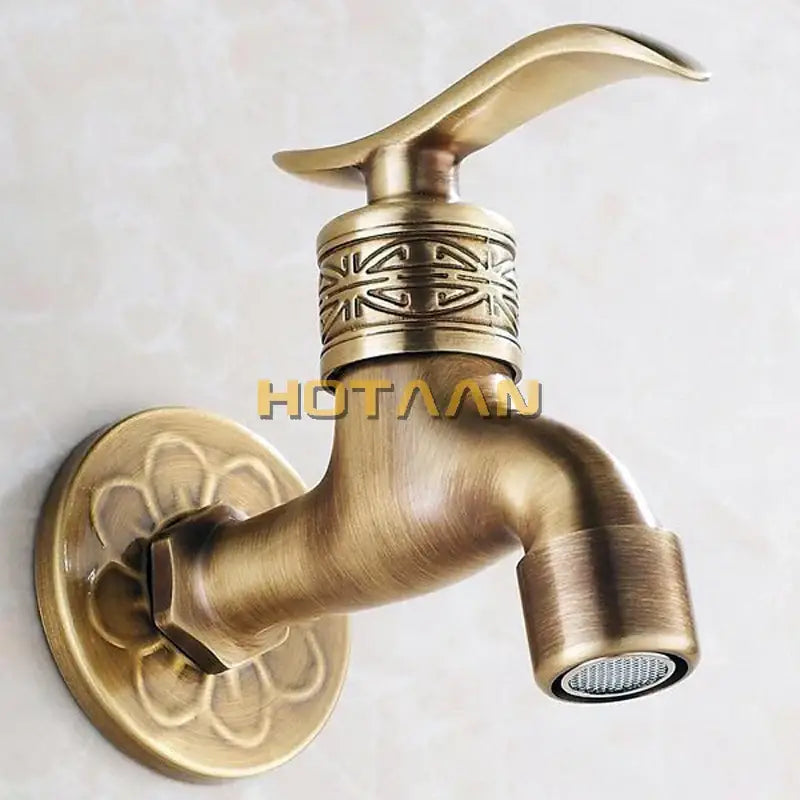 Ornate embossed antique brass wall mount faucet bathroom fixture