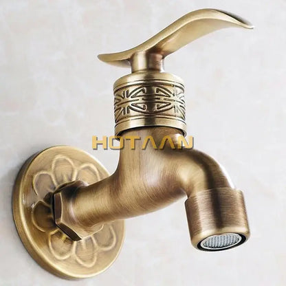 Ornate embossed antique brass wall mount faucet bathroom fixture