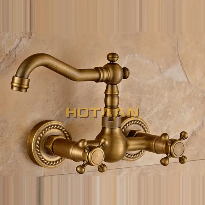 Antique brass wall mounted kitchen faucet with twisted rope detail
