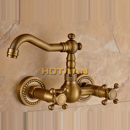 Antique brass wall mounted kitchen faucet with twisted rope detail