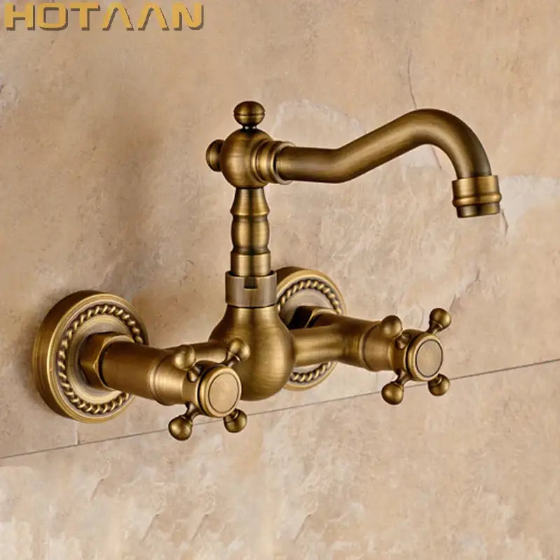 Antique brass wall mounted kitchen faucet with twisted rope detail