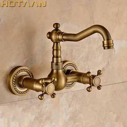 Antique brass wall mounted kitchen faucet with twisted rope detail
