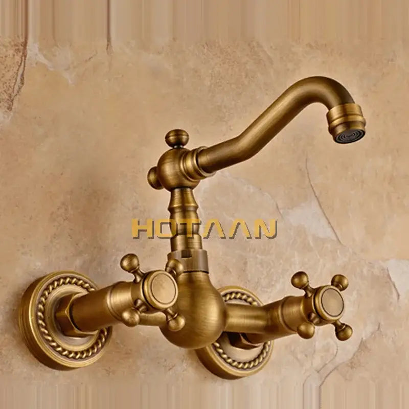 Antique brass wall mounted kitchen faucet with twisted rope detail