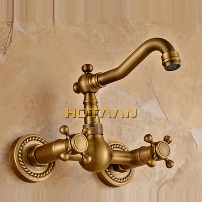 Antique brass wall mounted kitchen faucet with twisted rope detail