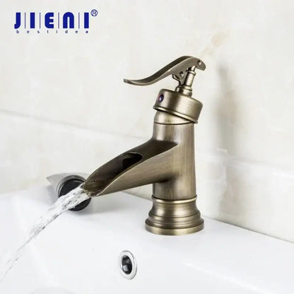 Antique brass waterfall basin faucet with art handle for bathroom