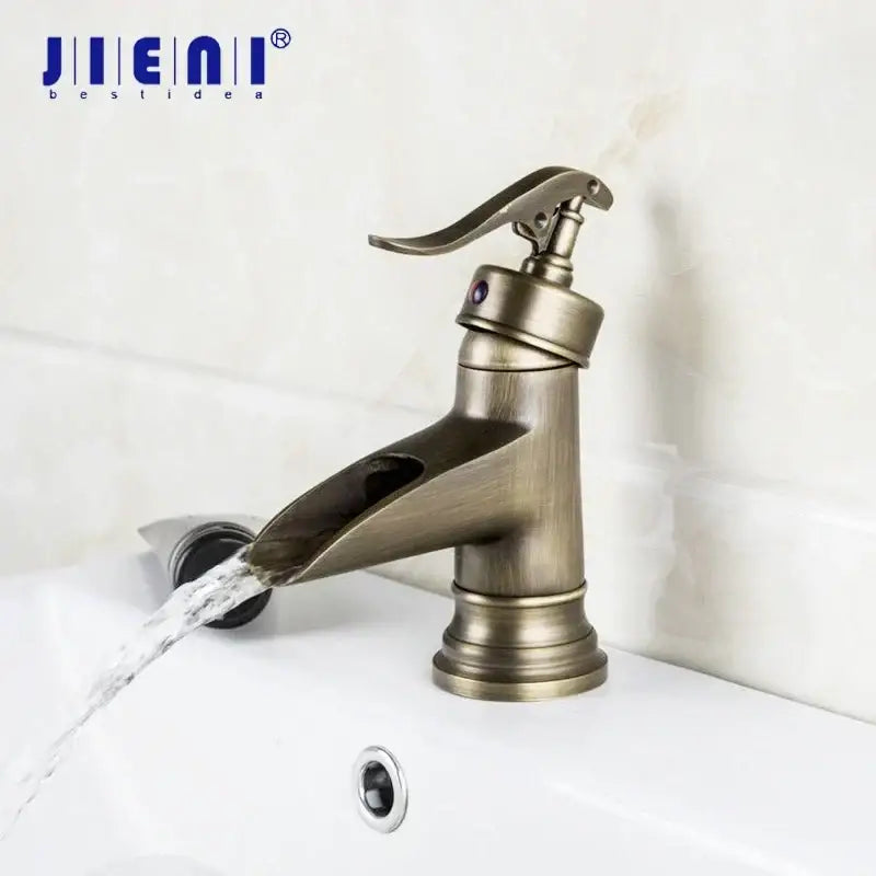 Antique brass waterfall basin faucet with art handle for bathroom