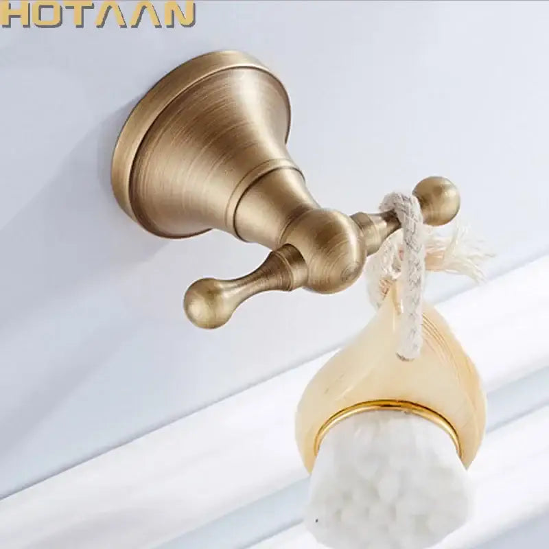 Antique brass wall hooks with teardrop wood and bristles bedroom rack