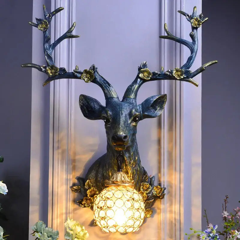 Antique bronze antler wall lamp with crystal globe for living room