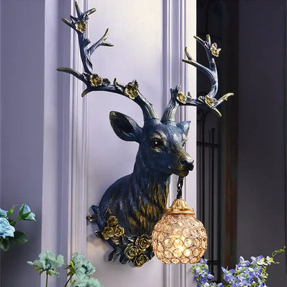 Antique bronze antler wall lamp with crystal globe for living room