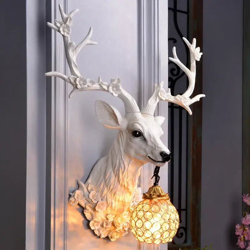 Antique bronze antler wall lamp with crystal globe for living room