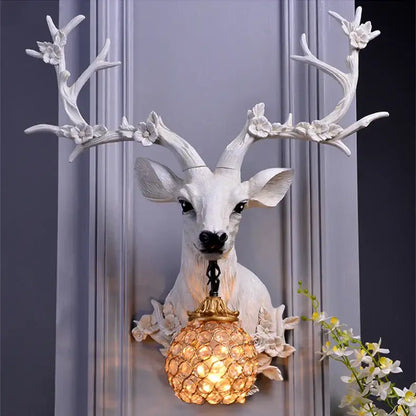 Antique bronze antler wall lamp with crystal globe for living room