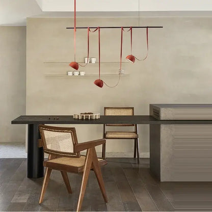 Art deco orange lustre cross belt pendant light – living room