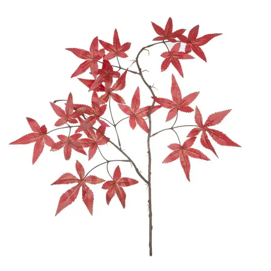 Vibrant red artificial maple leaf bouquet in white vase living room