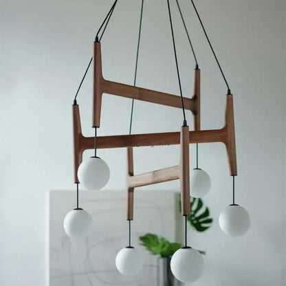 Modern astra wood pendant light with white glass shades dining room