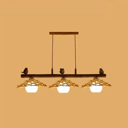 Rustic bamboo pendant with birds and white glass globe dining room