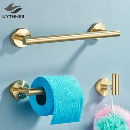 Modern brass bathroom hardware set with cylindrical towel rack