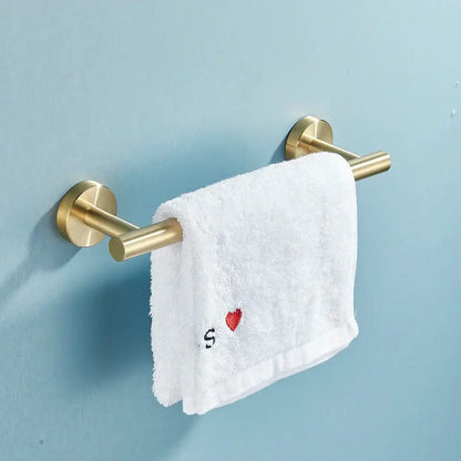 Modern brass bathroom hardware set with cylindrical towel rack