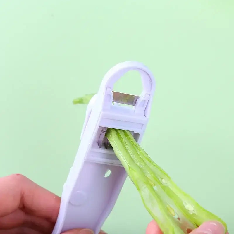 White plastic bean slicer cutter peeler for kitchen green beans