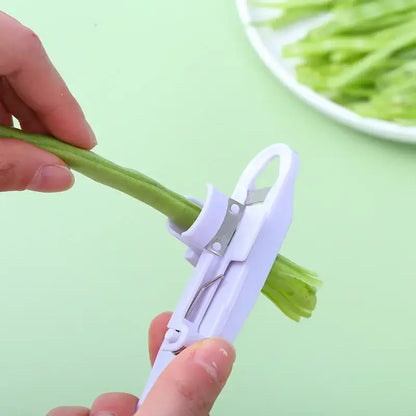 White plastic bean slicer cutter peeler for kitchen green beans