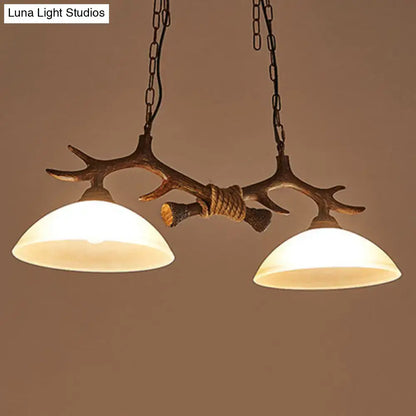 Rustic antler decor dark coffee island light beige glass dining room